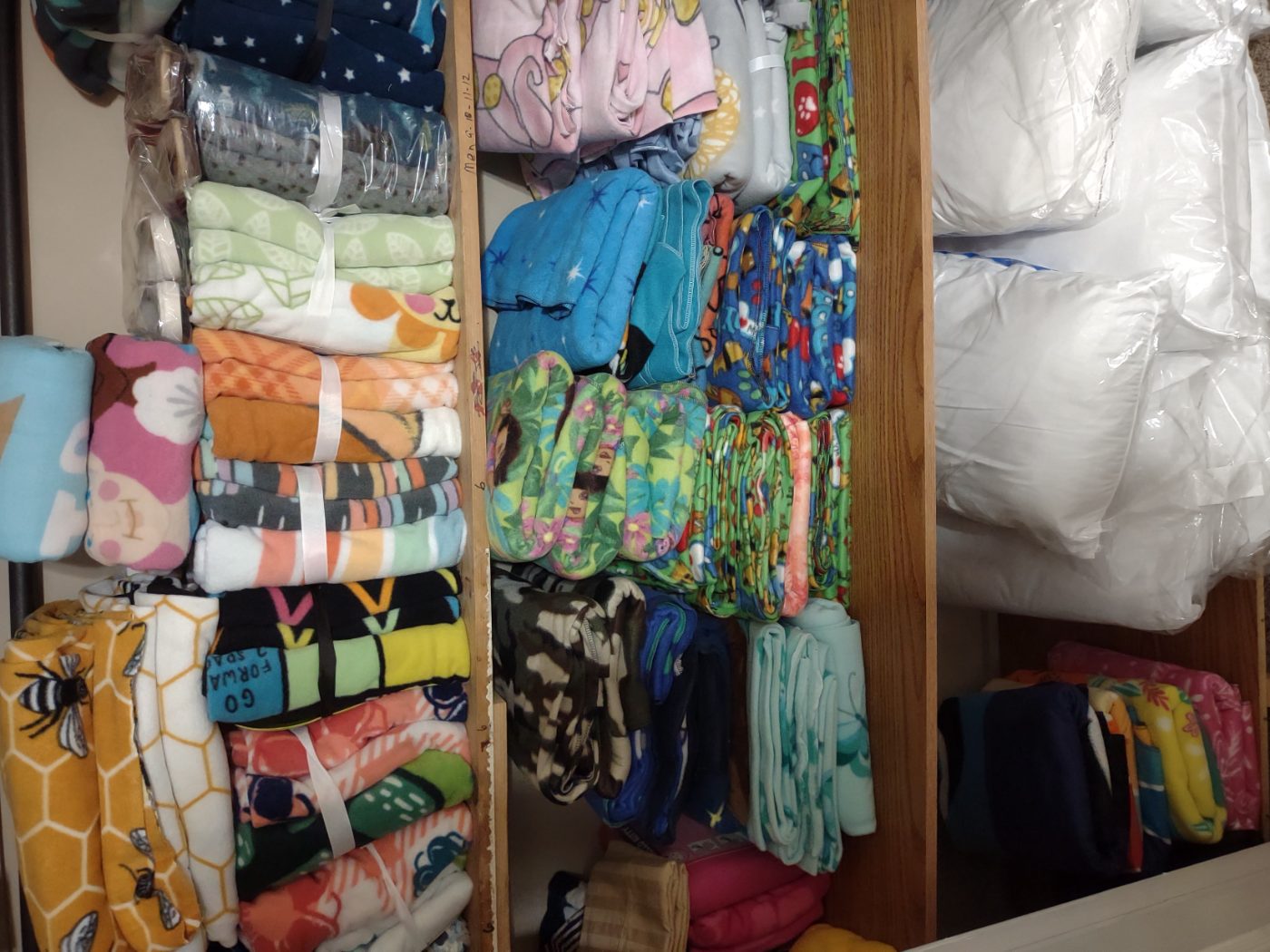 Shelves of folded blankets