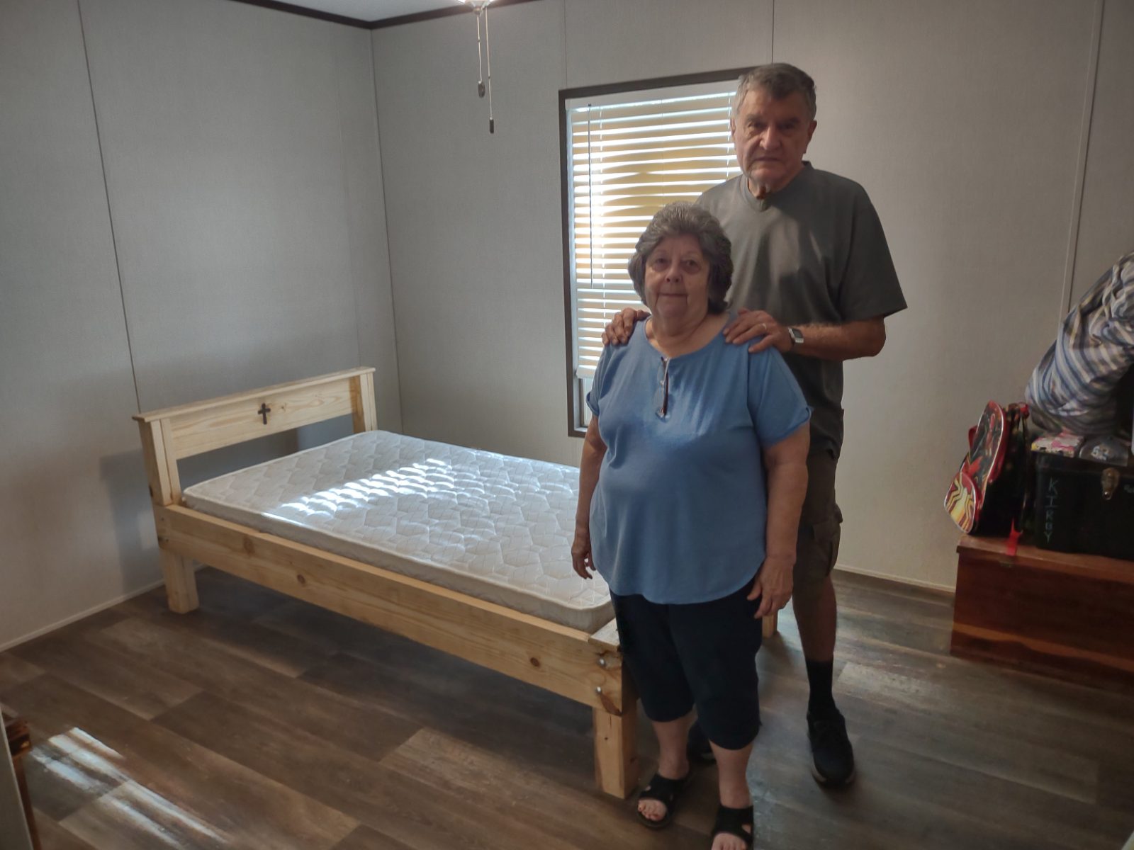 Carol and Danny with a finished bed